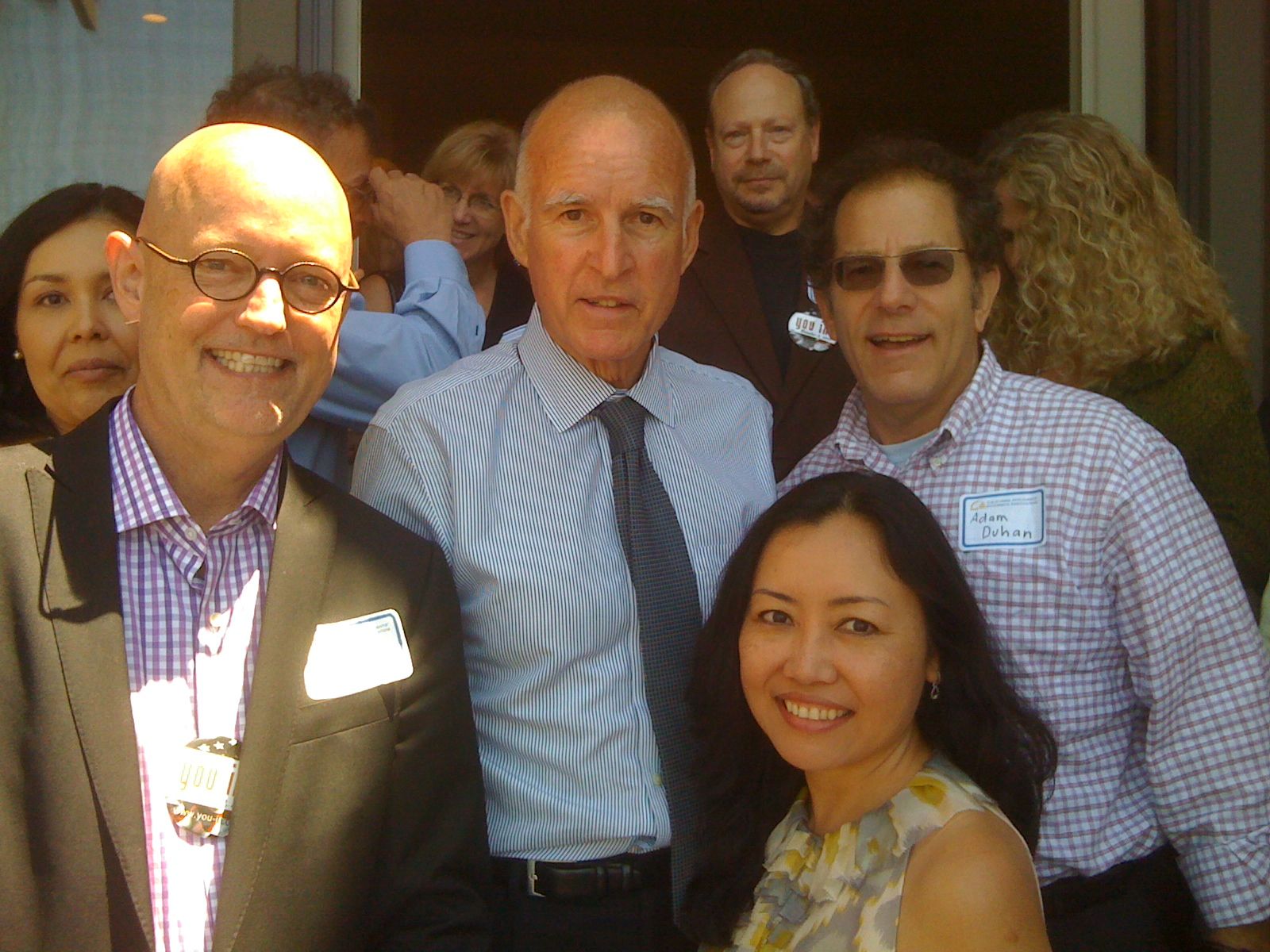 Oakland applicants' attorney Julius Young (left foreground) with Gov. Jerry Brown. Photo via Workers' Comp Zone blog.